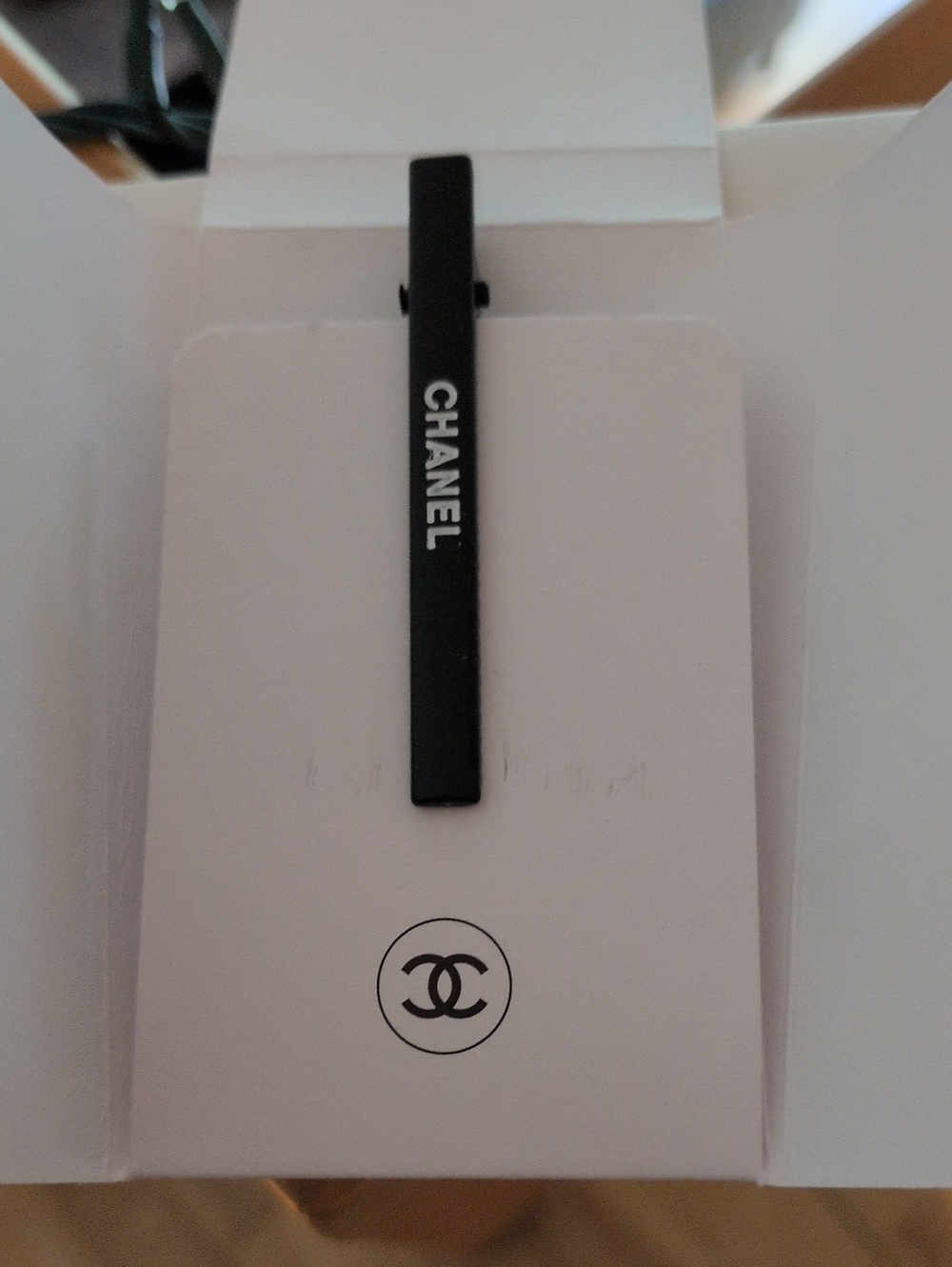 CHANEL Black little Barrette with White Logo